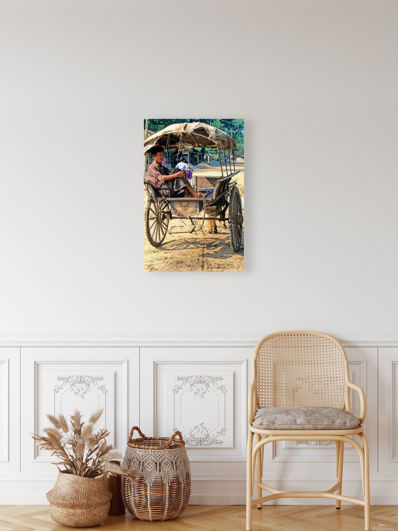 Man rests on cart in Myanmar during warm daytime Reproduction