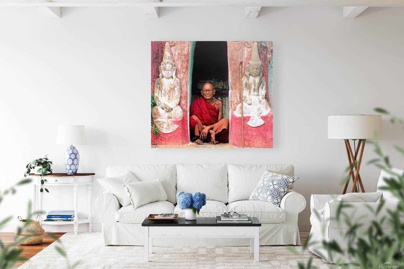 Old monk meditates in temple doorway in Myanmar Reproduction