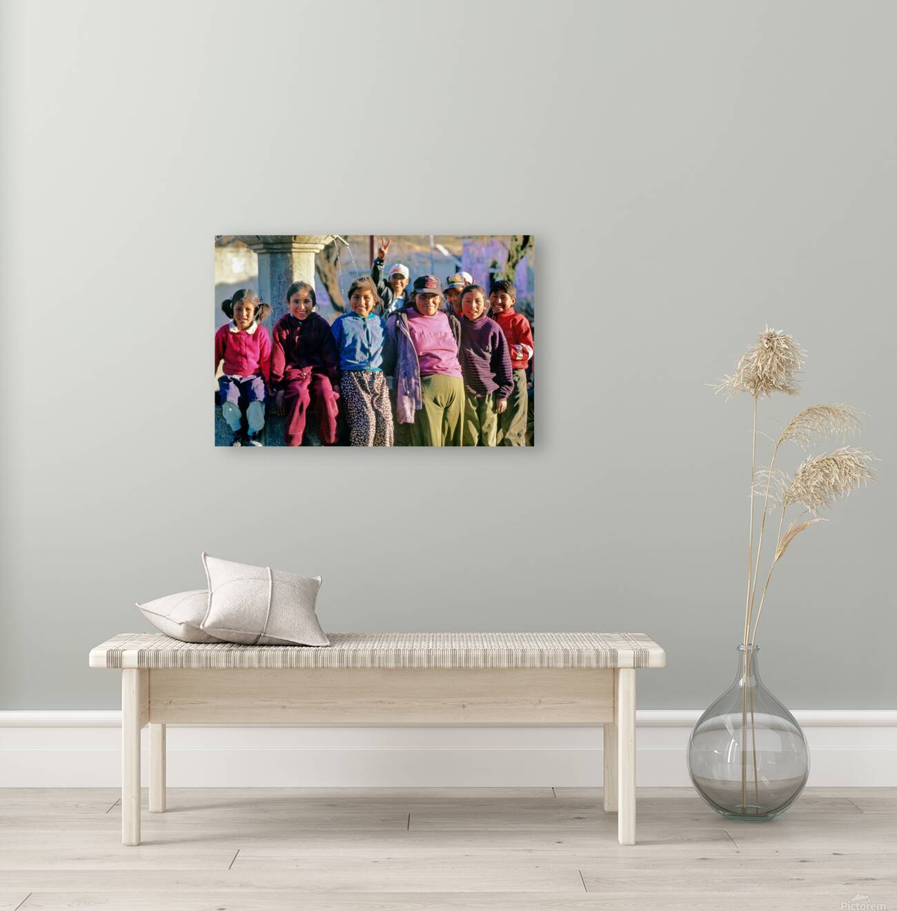 Smiling children and youth gather by a fountain. Reproduction