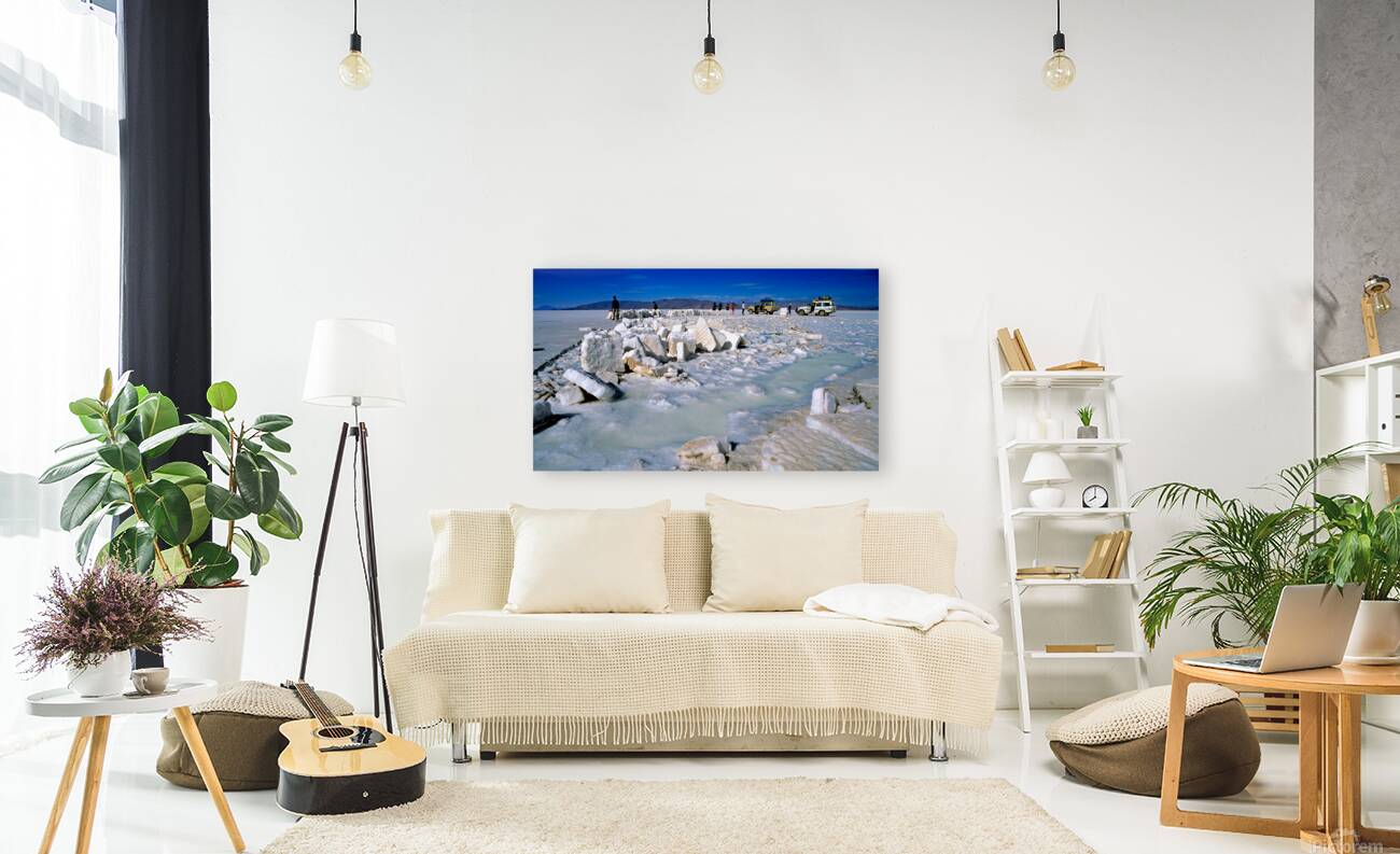 Explorers on a salt flat with salt blocks and water. Reproduction