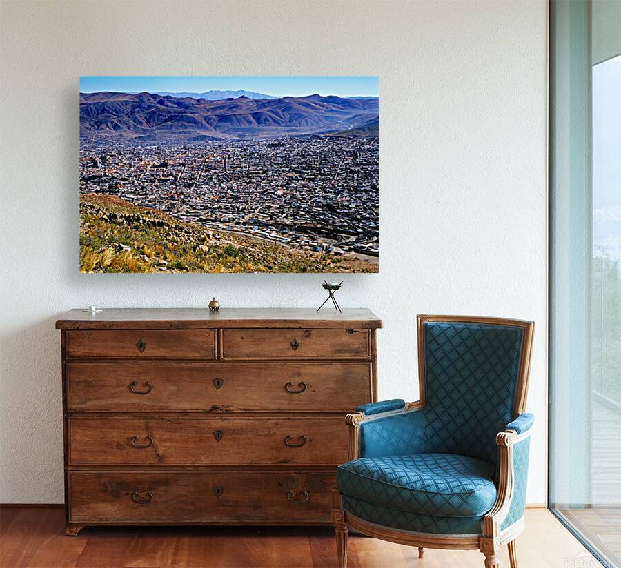 Panoramic view of a sprawling city in a mountain valley. Reproduction