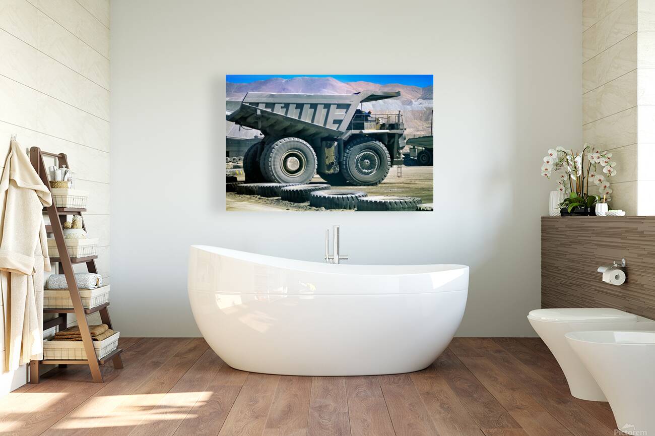 Giant mining dump truck in a dusty mountain quarry. Reproduction