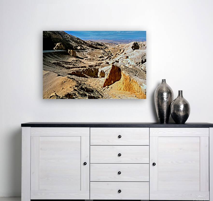 Dramatic arid mountain landscape with a winding road. Reproduction