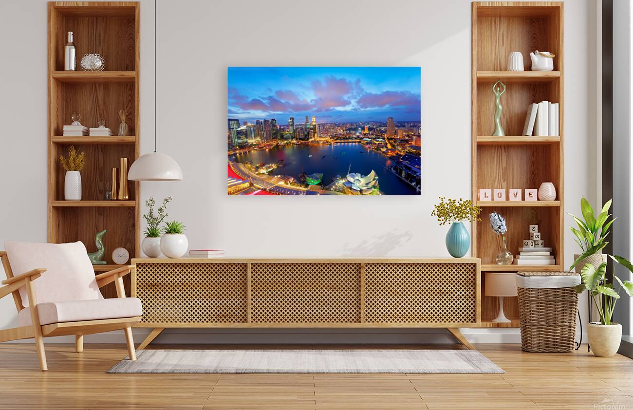 City lights shine over Marina Bay in Singapore at sunset Reproduction