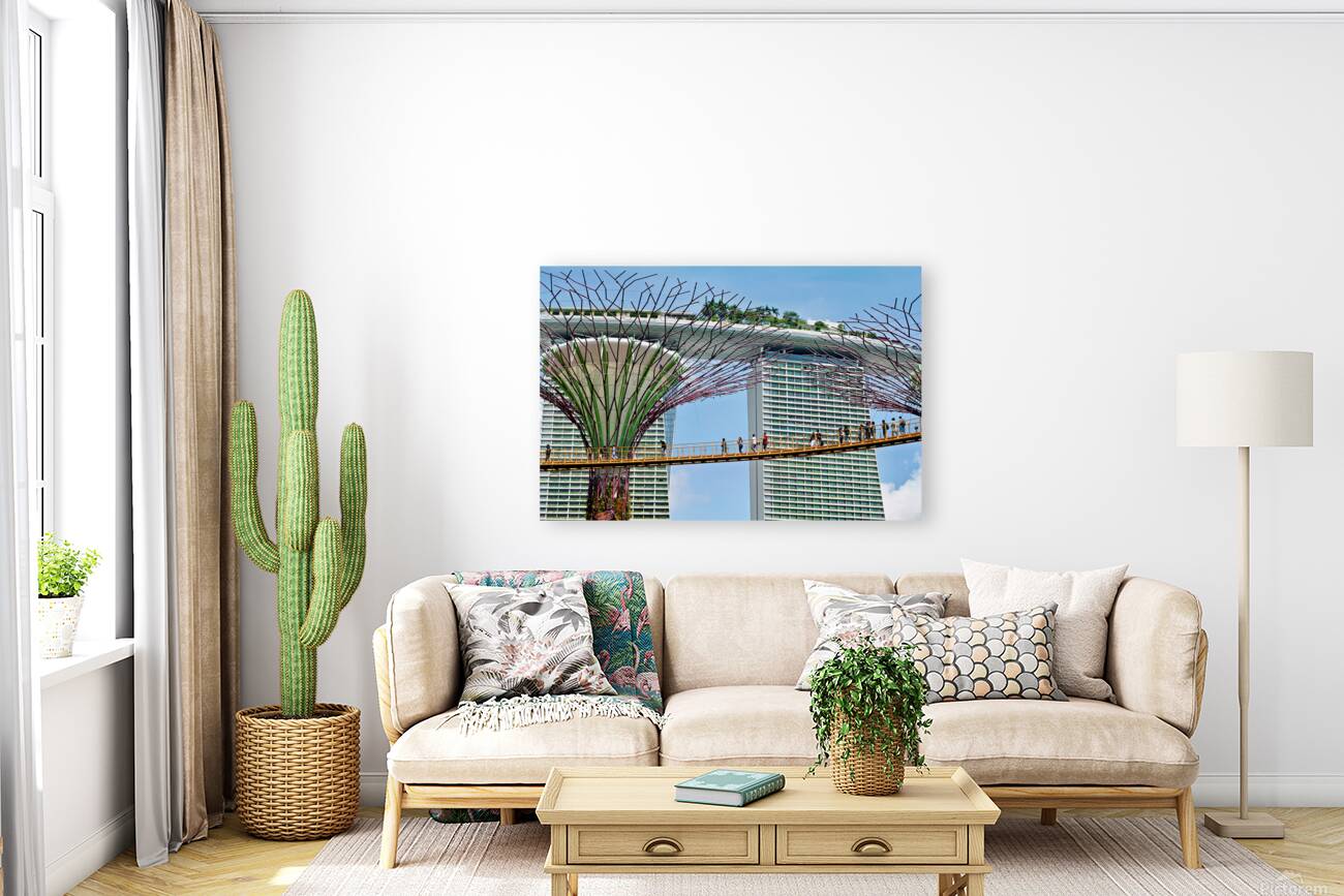 People walk on bridge connecting to Supertree Grove in Singapore Reproduction