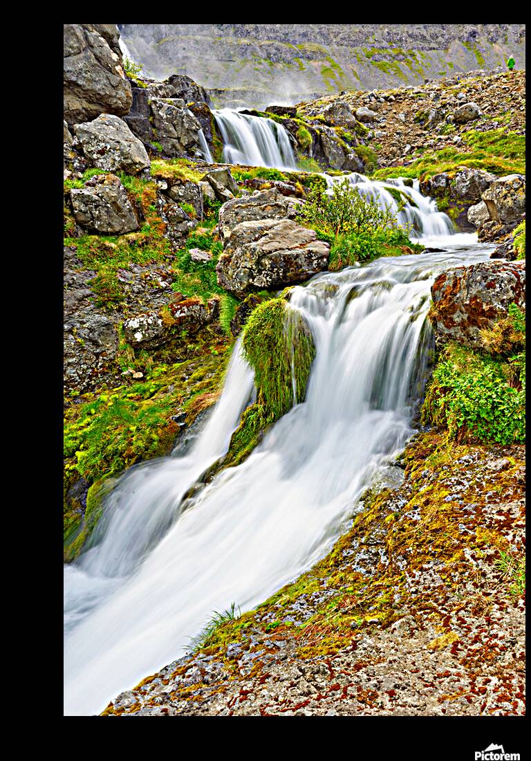 Gongumannafoss waterfall flows in Iceland during daylight hours Reproduction