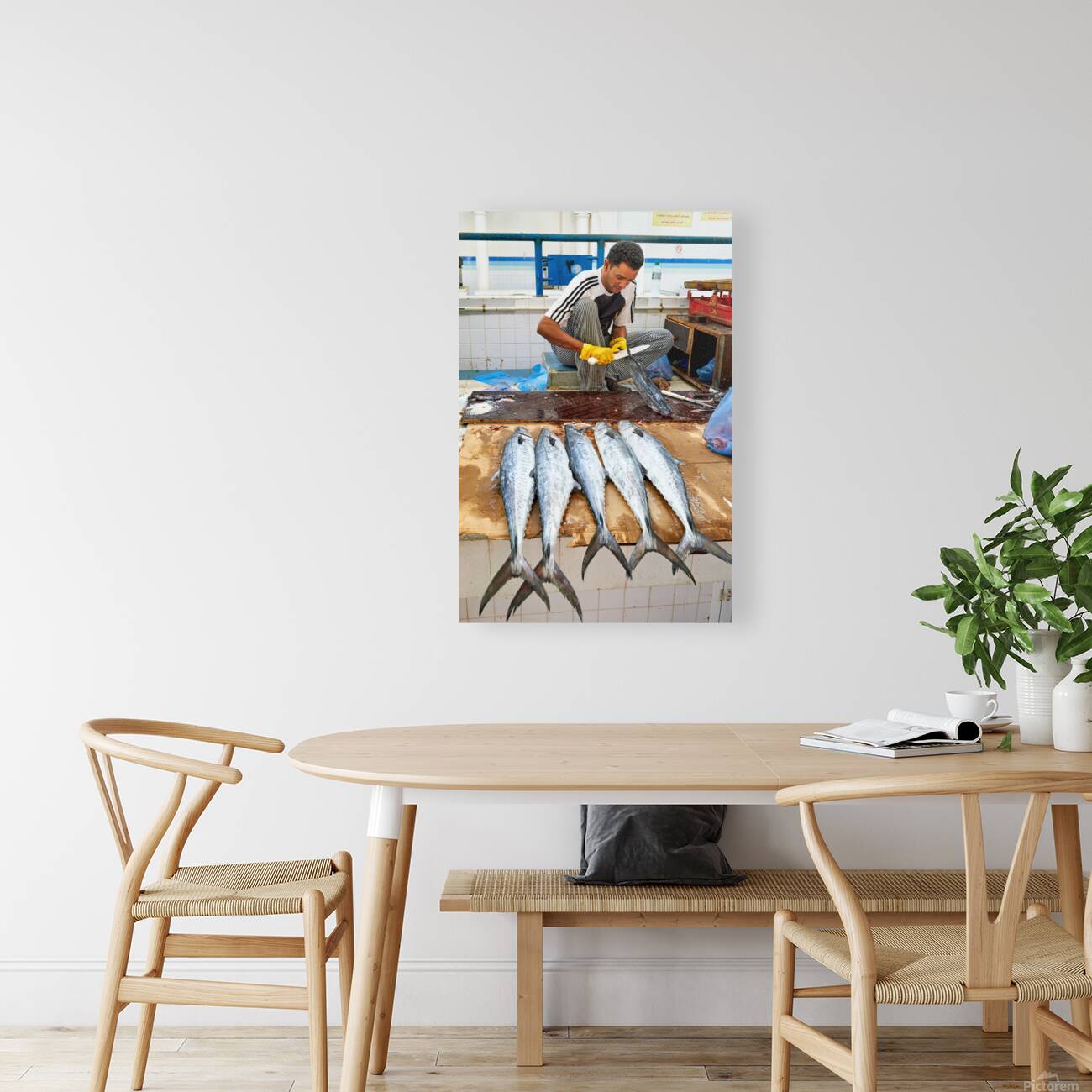 Fish seller prepares catch at Nizwa Oman fish market Reproduction