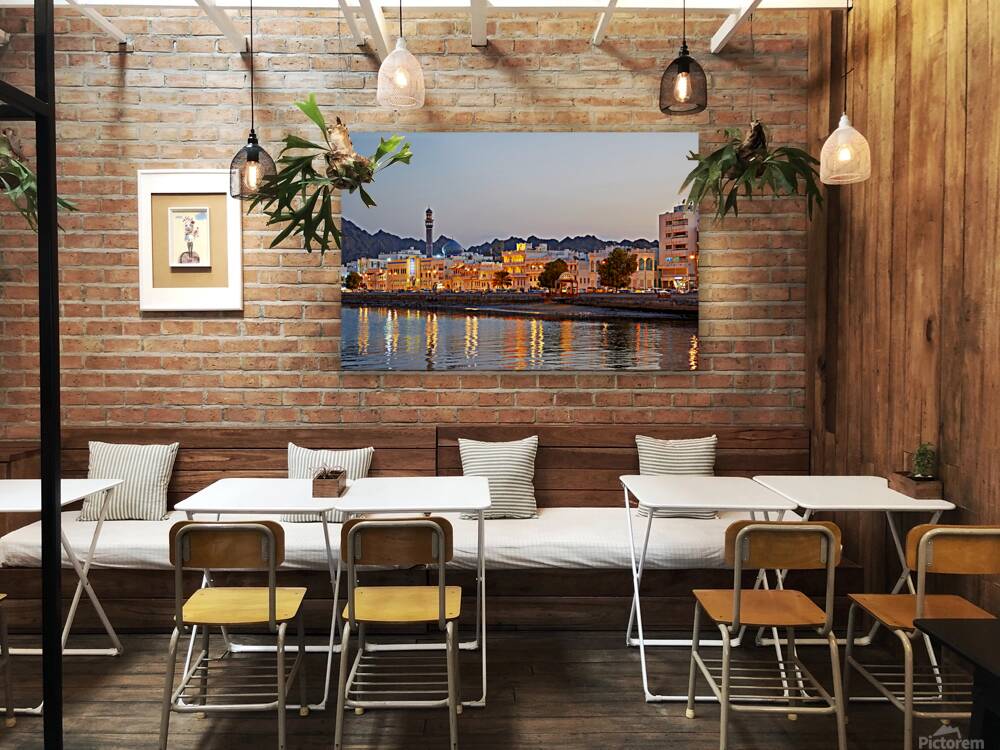 Sunset view of waterfront in Muscat Oman with city lights Reproduction