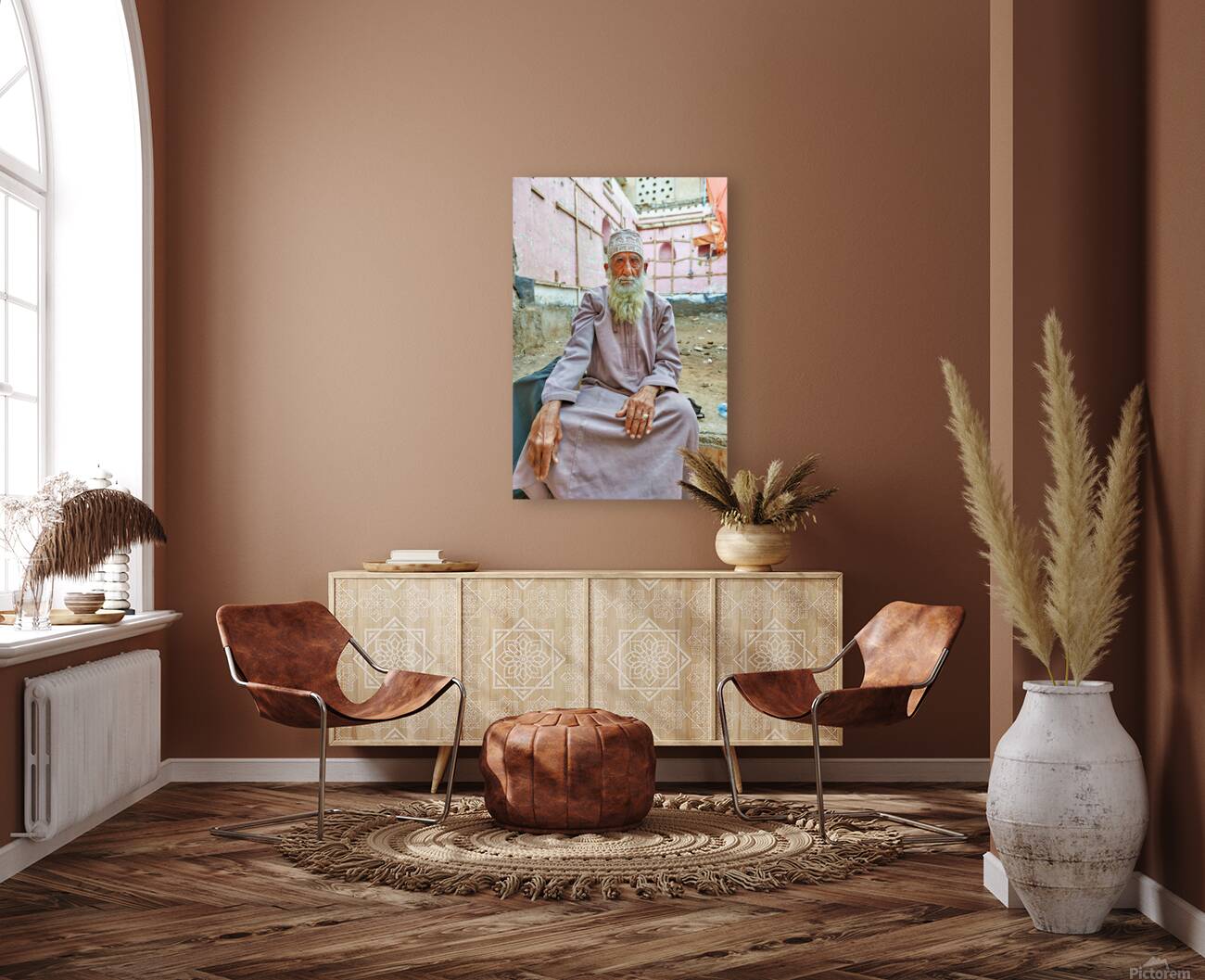 Old man sitting in a historical site in Muscat Oman Reproduction