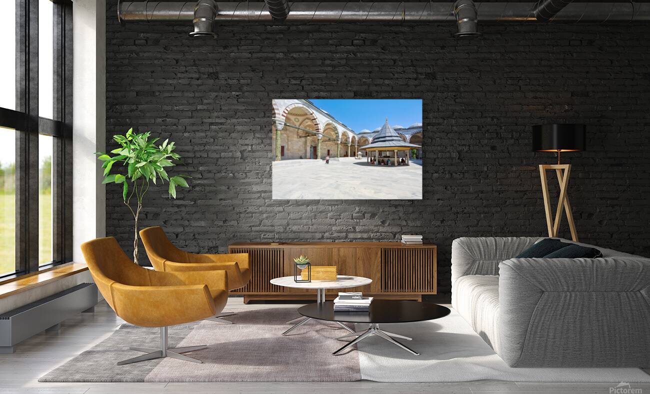 Visitors explore the courtyard at Fatih Mosque in Istanbul Reproduction