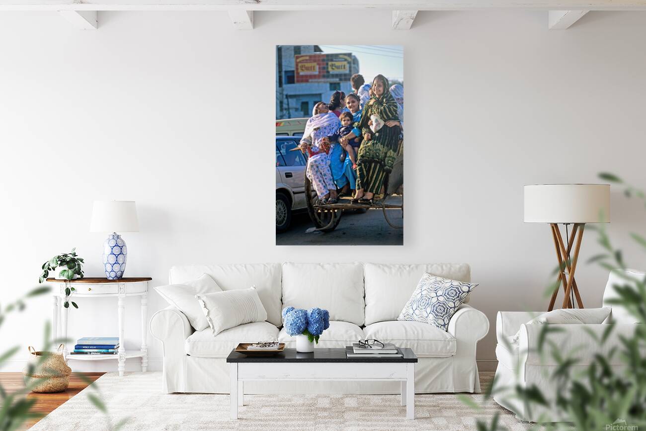 Family travels on rickshaw in busy Lahore streets Reproduction