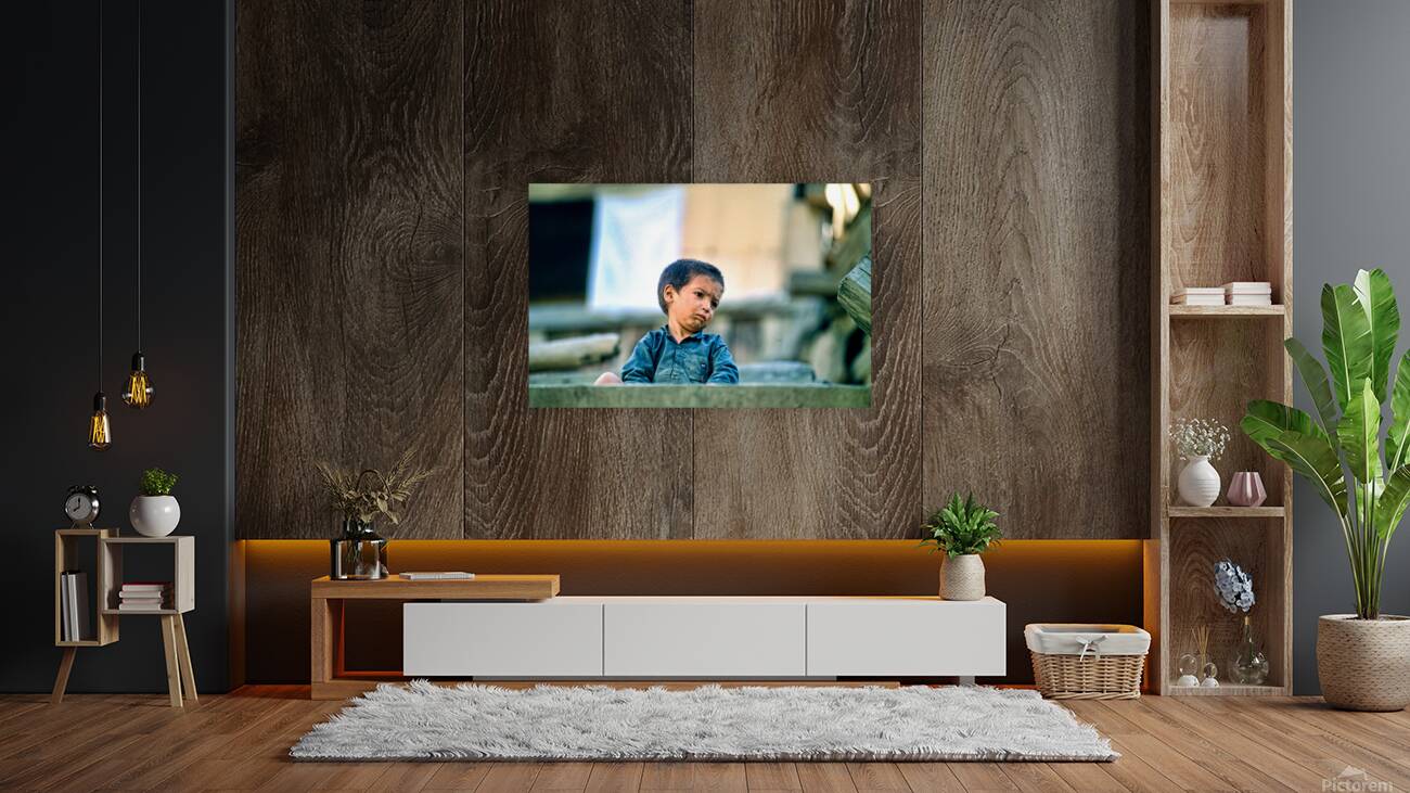 Sad boy sitting on stairs in Lahore Pakistan during the day Reproduction