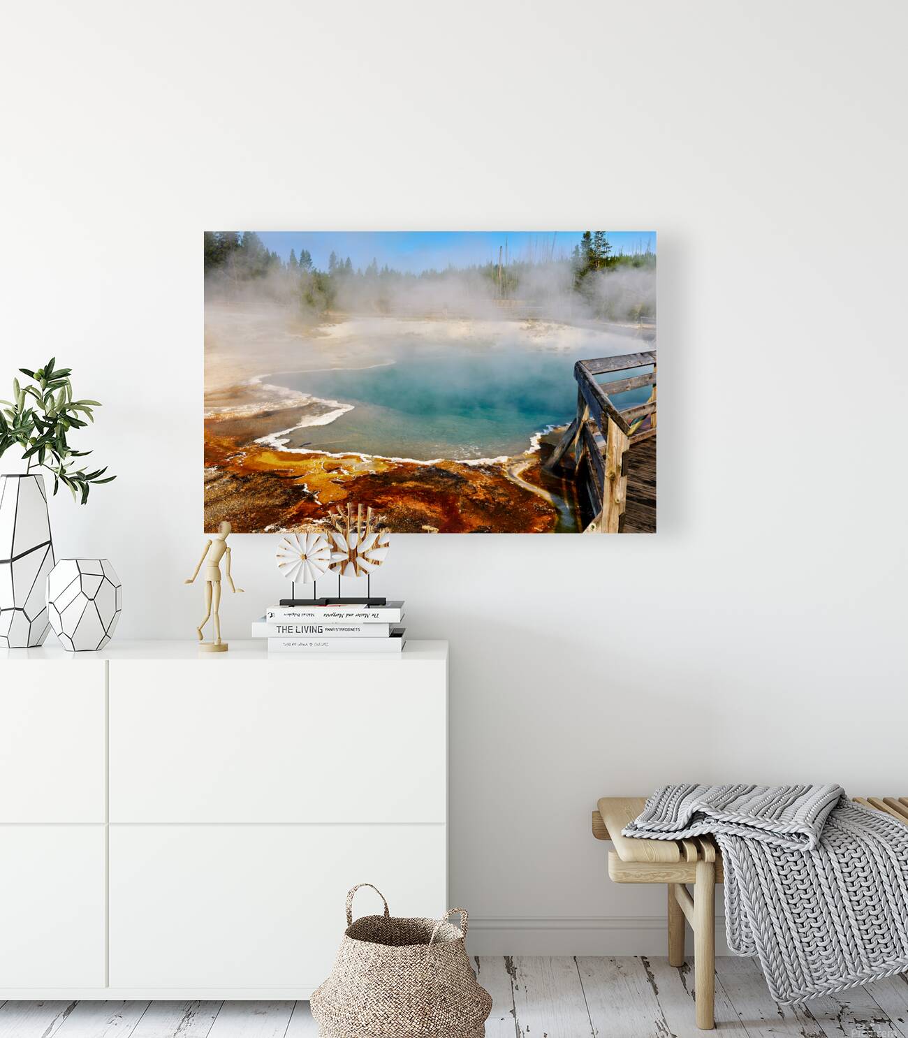 Steam rises from Abyss Pool as blue water reflects the surrounding landscape at Yellowstone National Park. Visitors explore the area nearby. Reproduction