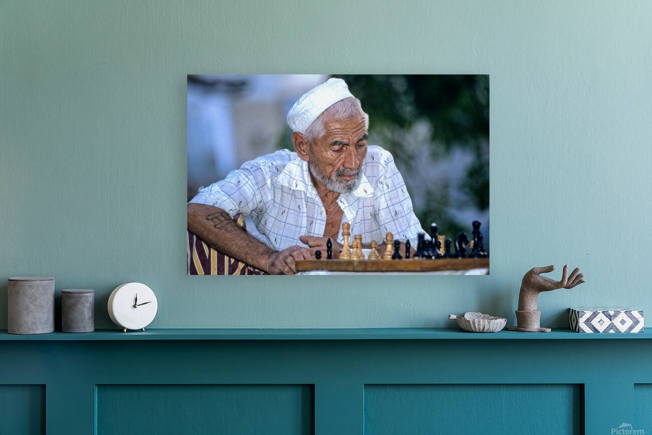 Elderly man plays chess in Bukhara Uzbekistan Reproduction
