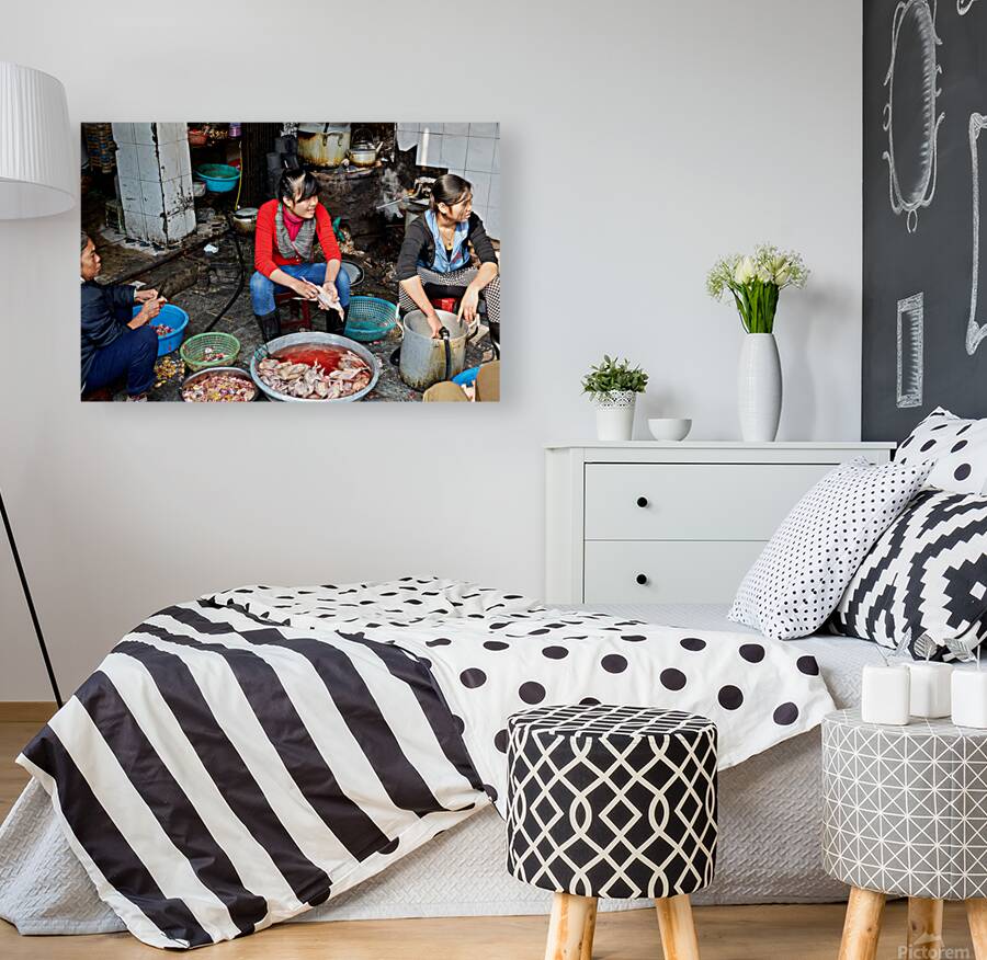 Women preparing fish in a market in Hanoi Vietnam Reproduction