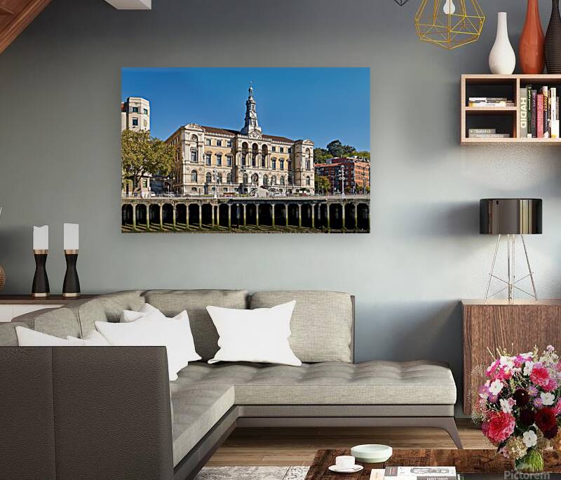 Building stands in Bilbao Spain next to water and trees Reproduction