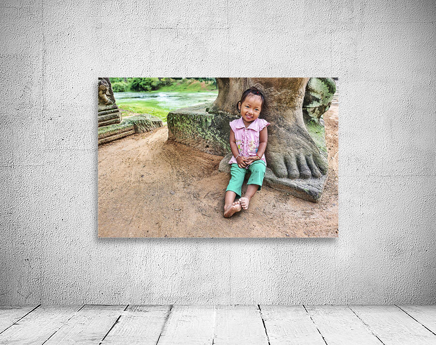 Portrait of a cute child at Preah Khan Temple. Siem Reap. Cambodia Wall Preview