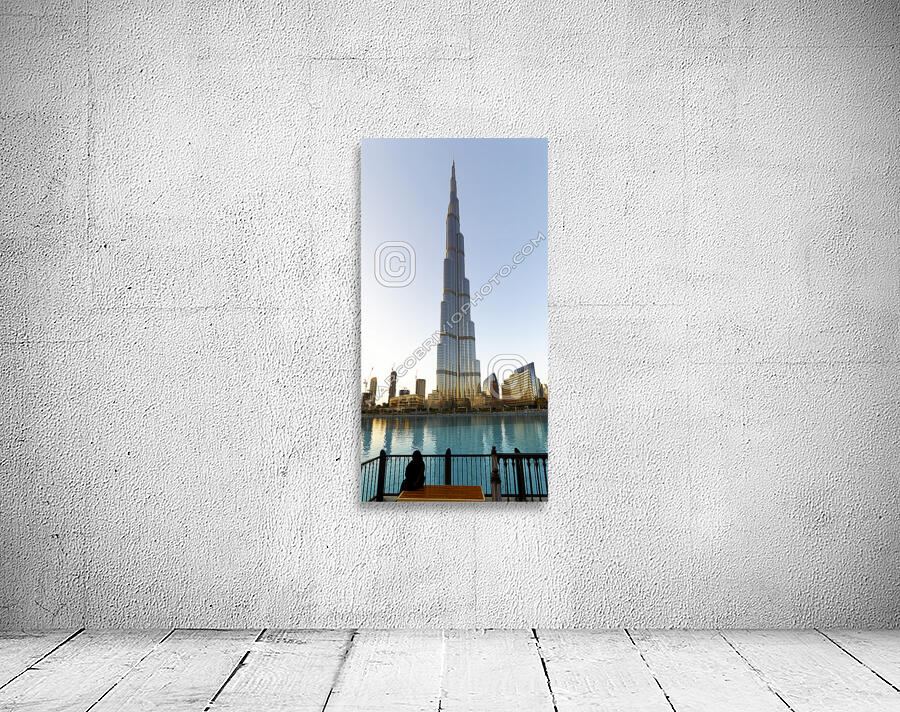 Dubai. UAE. Burj Khalifa. A veiled woman on a bench Wall Preview