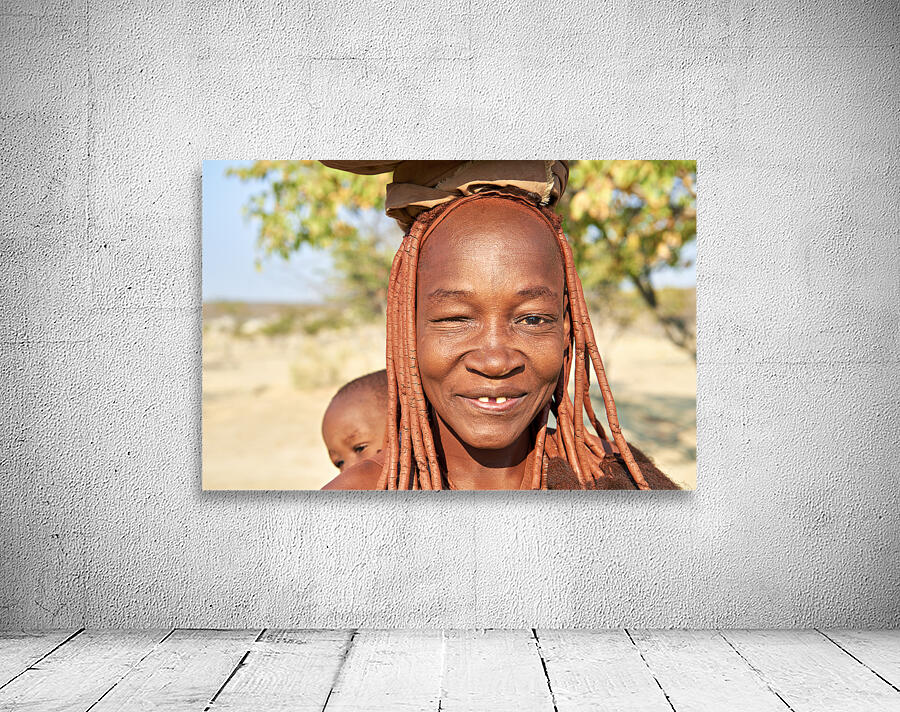 Namibia. Portrait of a smiling Himba woman with her baby in Kunene region Wall Preview