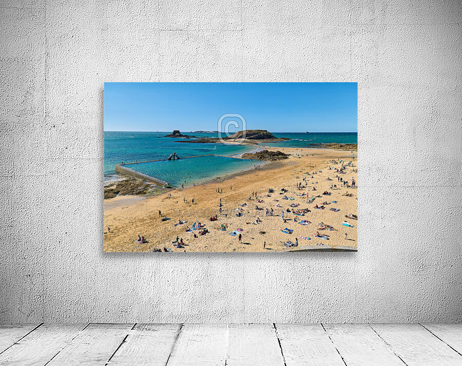 Saint Malo Brittany France. Sunbathers at plage du Mole Mole beach Wall Preview