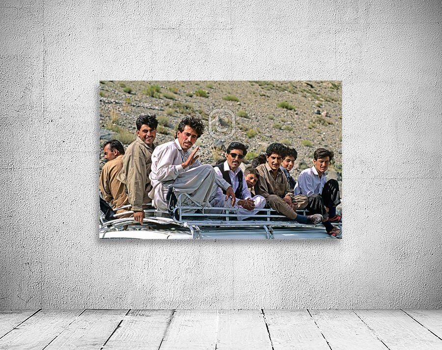Pakistan. People travelling on the roof of a van Wall Preview