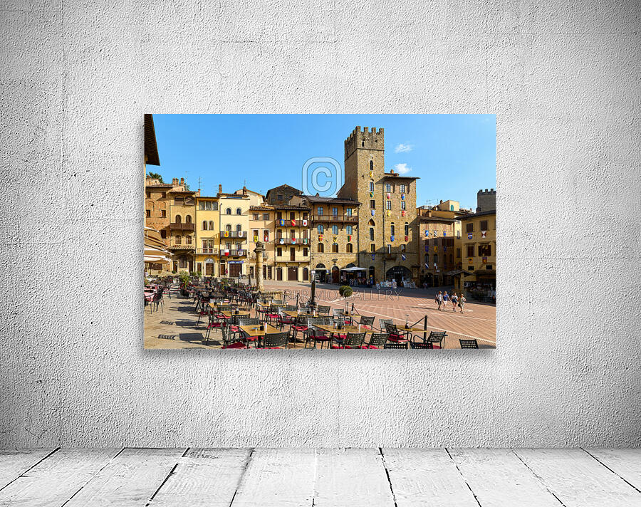 Arezzo Tuscany Italy. A group of people walking in Piazza Grande Wall Preview