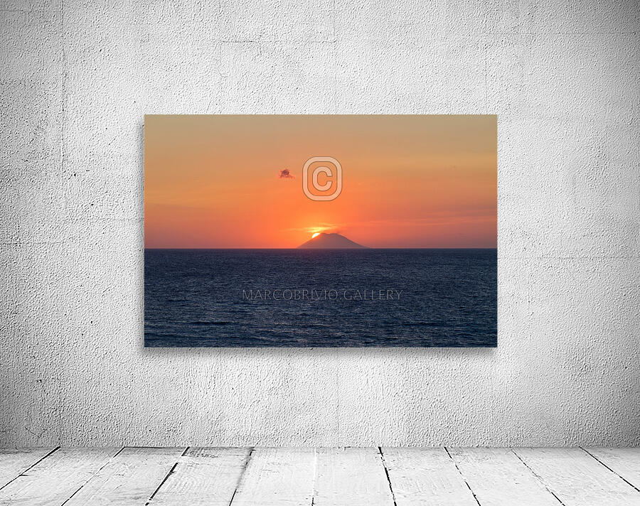 Tropea Calabria Italy. The sun sets in the crater mouth of Stromboli volcano Wall Preview