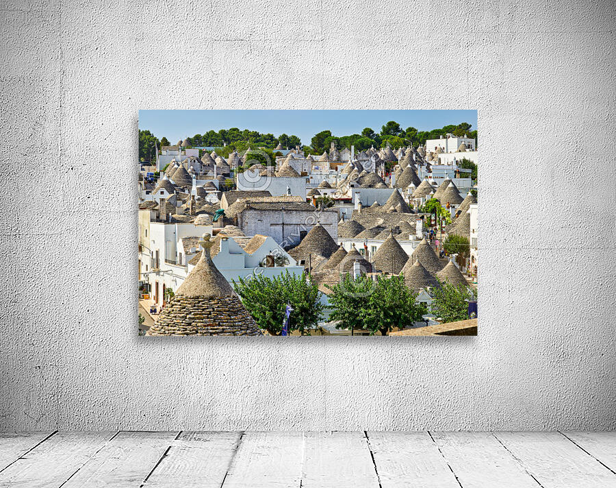 Apulia Puglia Italy. Alberobello. Trulli: traditional Apulian dry stone huts with a conical roof. Wall Preview