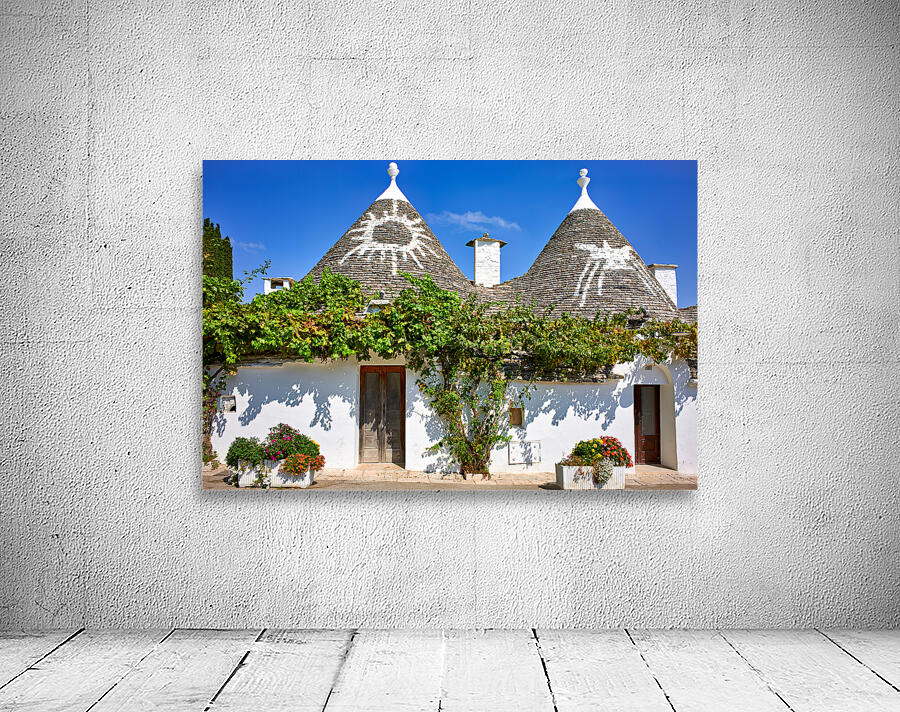 Apulia Puglia Italy. Alberobello. Trulli: traditional Apulian dry stone huts with a conical roof. Wall Preview