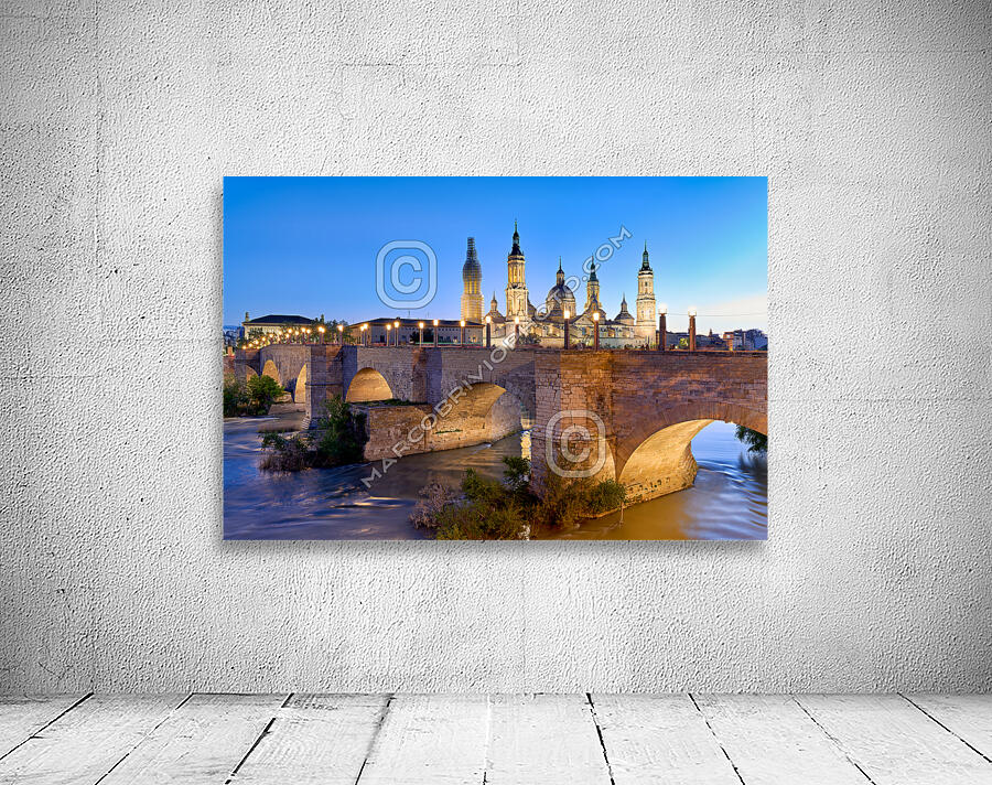 Zaragoza. Saragossa. Aragon. Spain. Cathedral Basilica of Our Lady of the Pillar and river Ebro at sunset Wall Preview