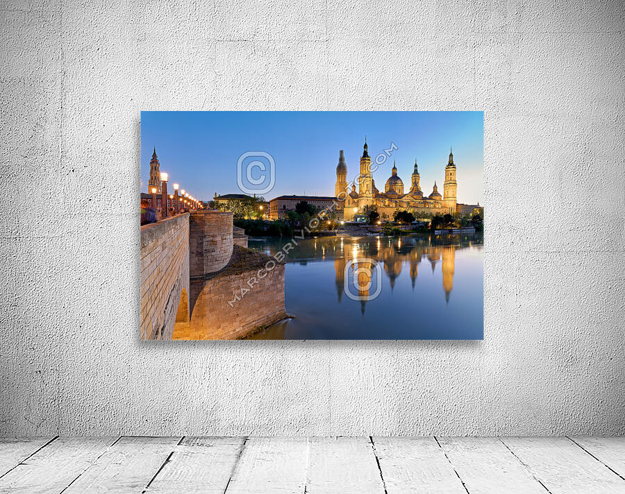 Zaragoza. Saragossa. Aragon. Spain. Cathedral Basilica of Our Lady of the Pillar and river Ebro at sunset Wall Preview