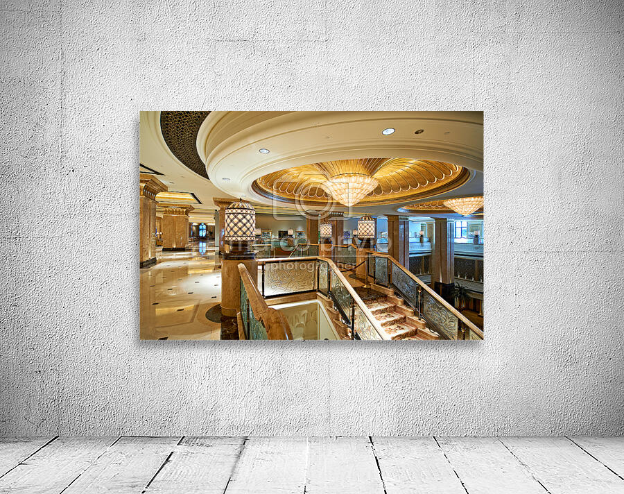 Opulent hotel lobby with grand staircase and golden chandeliers. Wall Preview