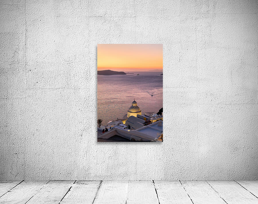 Sunset over Santorini caldera with church and boats. Wall Preview