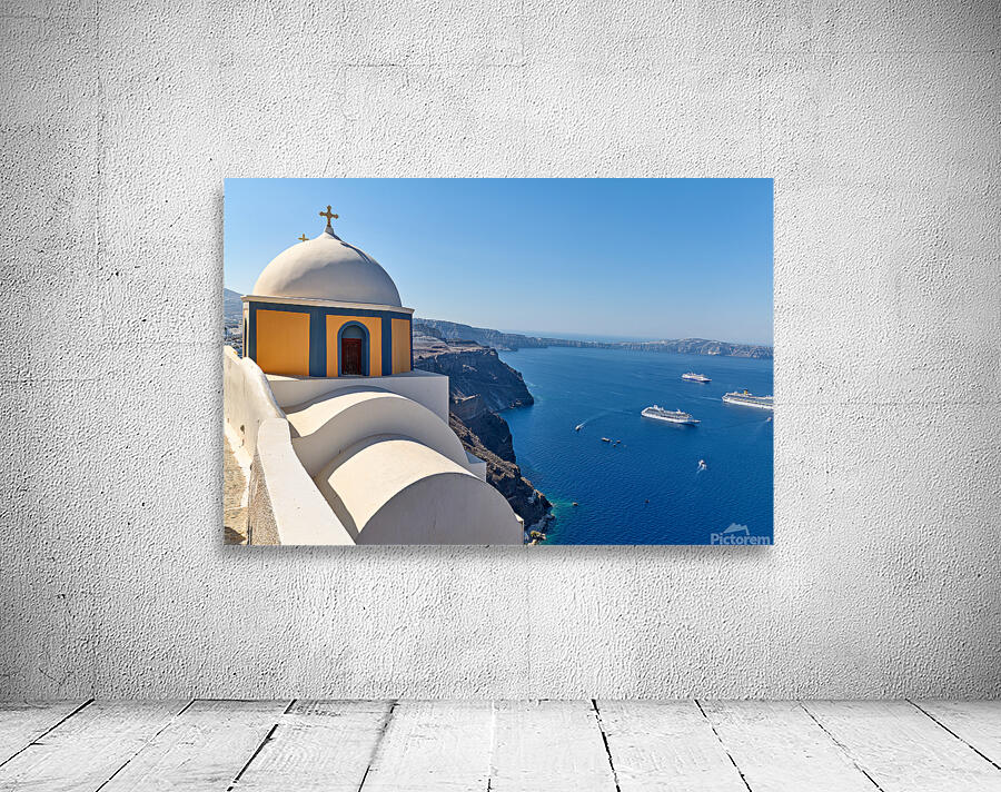 Santorinis iconic church and caldera with ships. Wall Preview