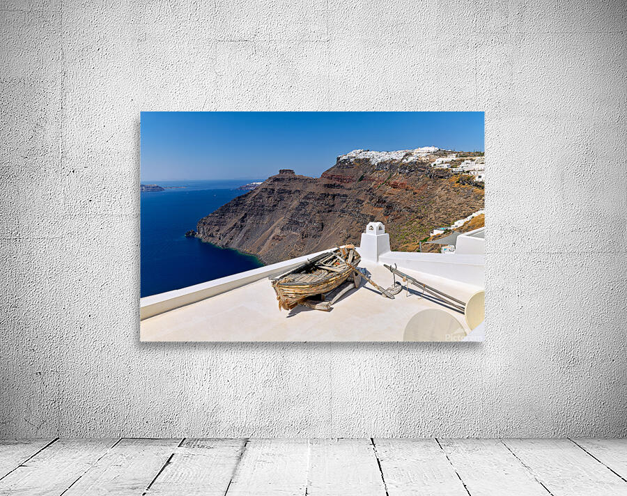 Santorini: Old boat white village and caldera view. Wall Preview