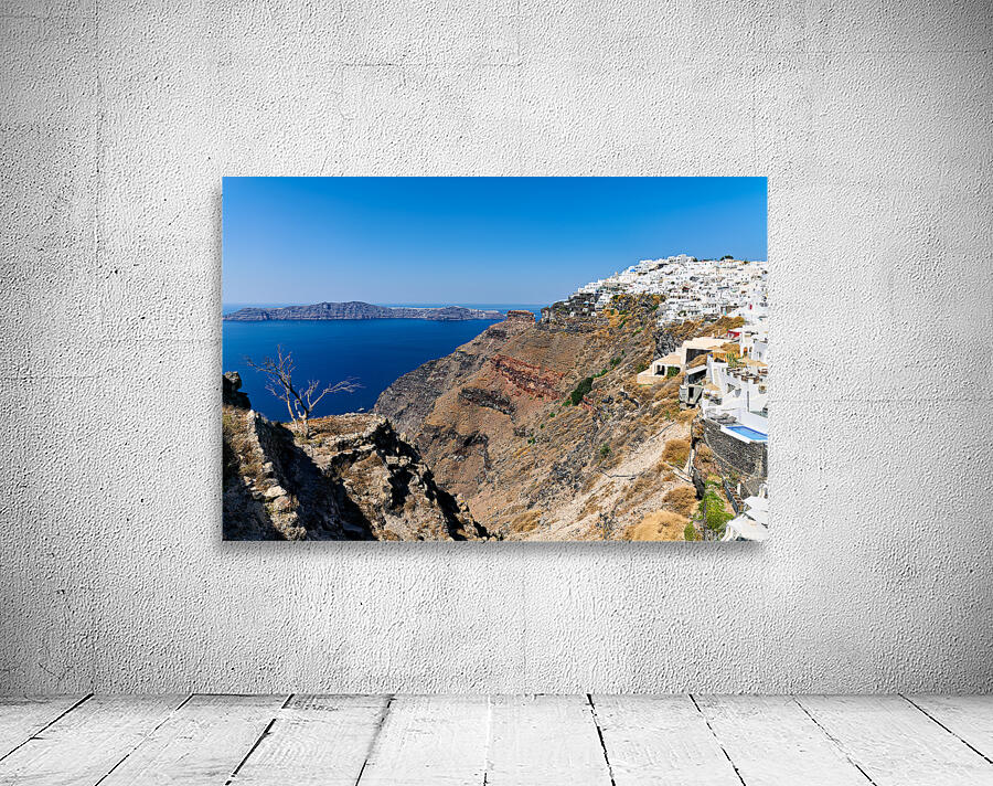 Picturesque Santorini: white village blue sea volcanic cliffs. Wall Preview