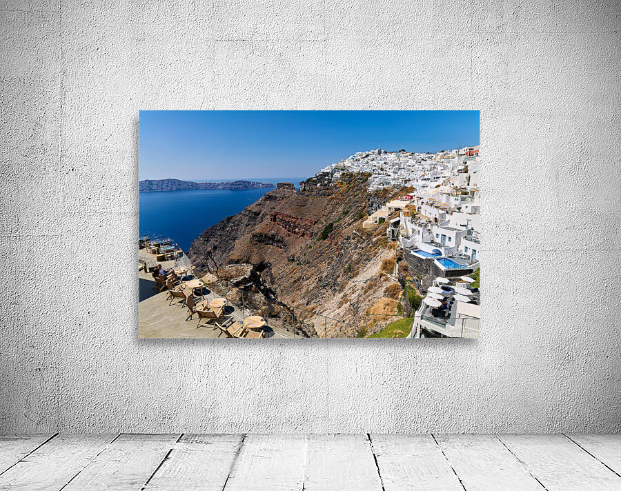Santorinis white cliffside village and caldera view. Wall Preview