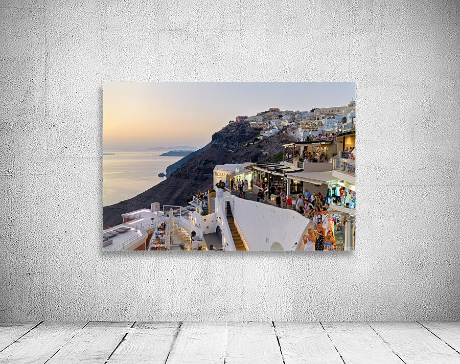 Santorini cliffside town with restaurants and people enjoying th Wall Preview
