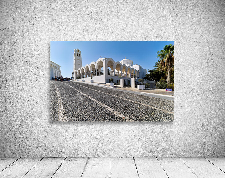 Beautiful white church and cobblestone street in sunny Santorini Wall Preview