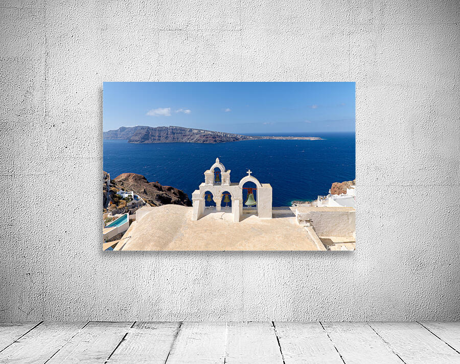 Iconic Santorini bell tower overlooking the caldera and Aegean S Wall Preview