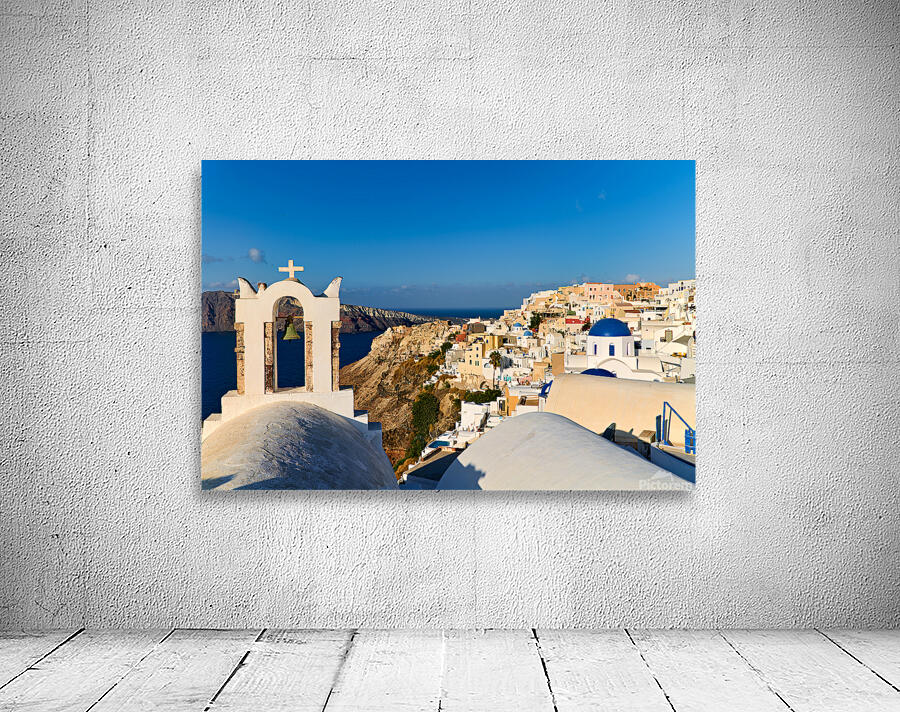 Santorini village with church bell tower overlooking caldera. Wall Preview