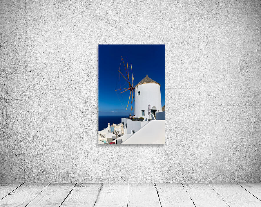 Santorini windmill and white architecture overlooking the blue s Wall Preview