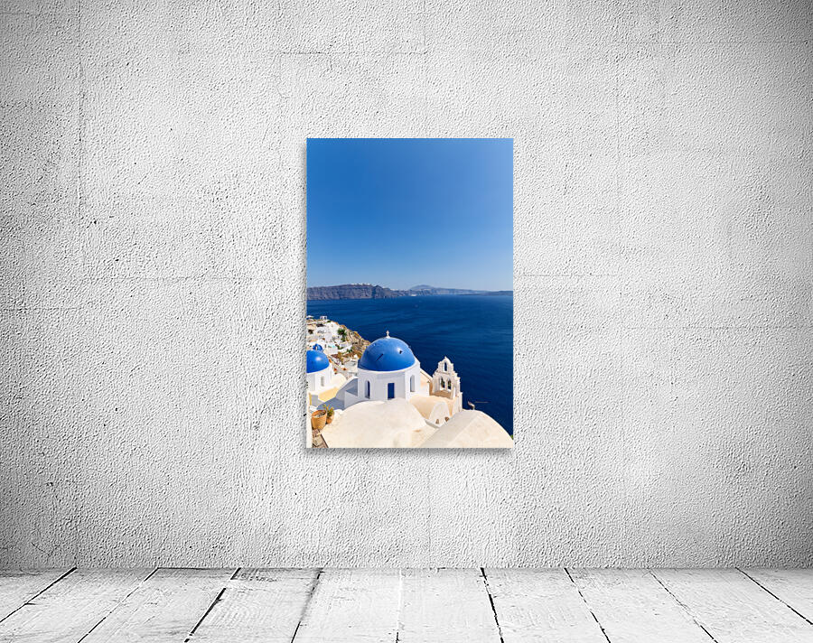 Iconic blue domes and white architecture of Santorini Greece. Wall Preview