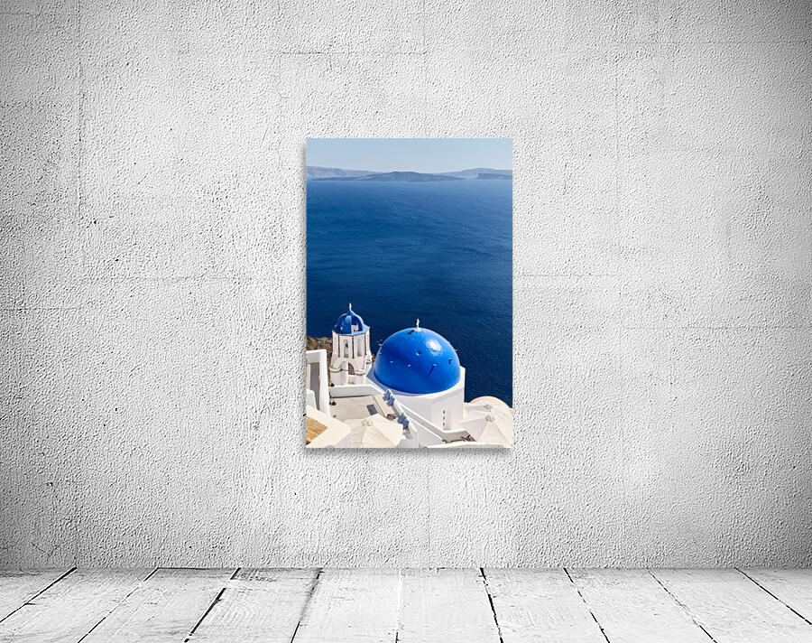 Santorinis blue domes and caldera view. Wall Preview