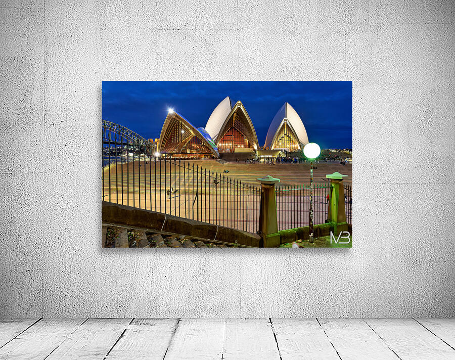 Sydney Opera House illuminated at dusk with crowds on steps. Wall Preview