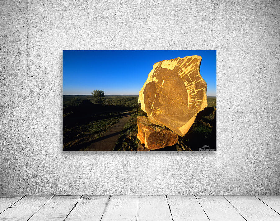 Carved stone monument in the Australian outback at sunset. Wall Preview