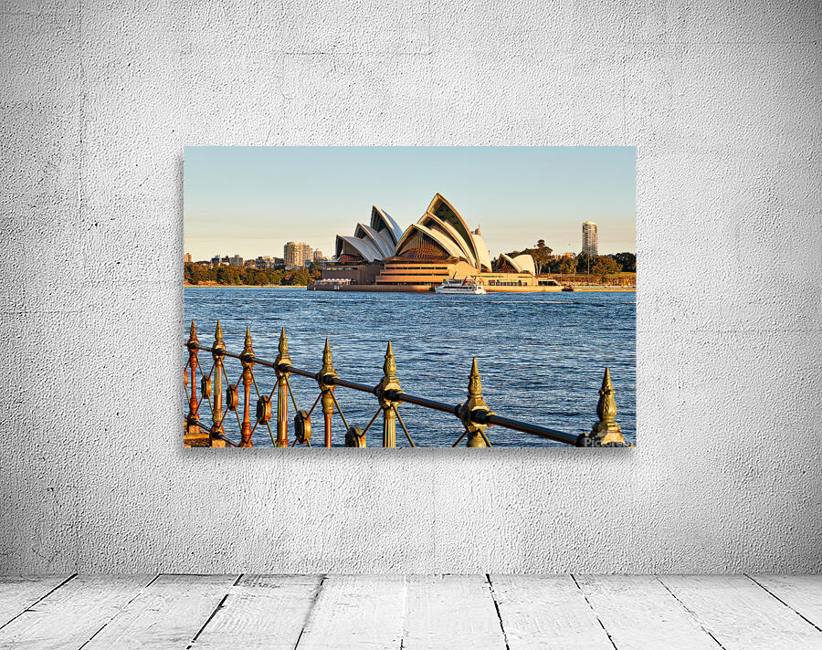 Sydney Opera House and harbor at sunset. Wall Preview