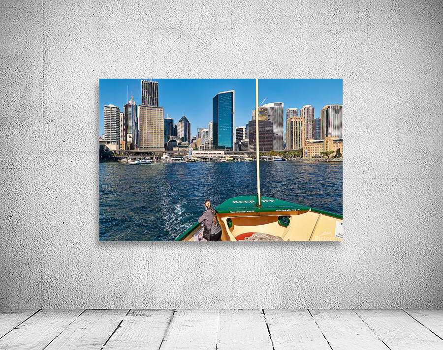 Sydney skyline viewed from a ferry on a sunny day. Wall Preview