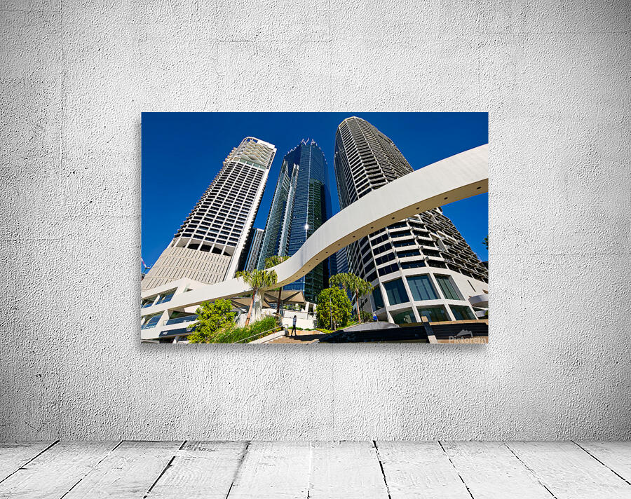 Woman walks on stairs in modern urban area with tall buildings Wall Preview