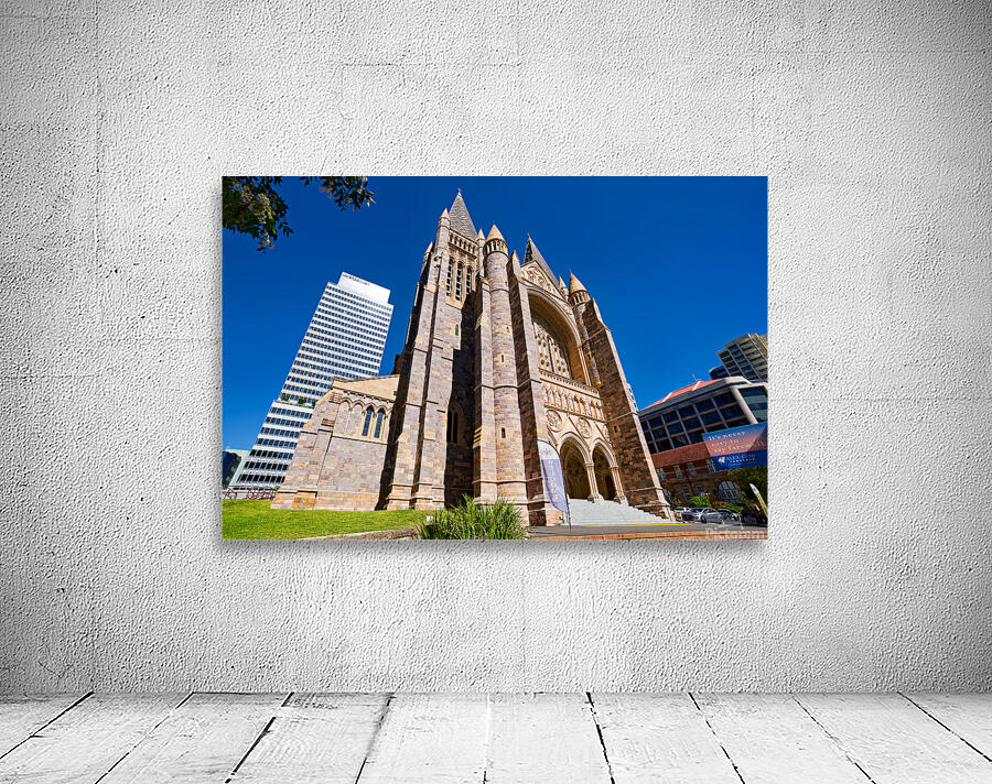 Historic church stands tall next to modern skyscrapers. Wall Preview